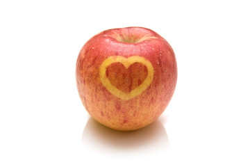 Fuji apple with a heart design on the skin.