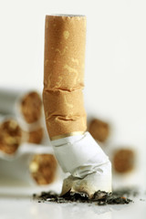 Close up of cigarette on white