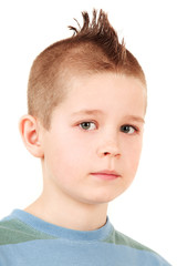 Young schoolboy in closeup portrait isolated