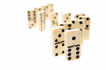 Dominoes standing on white background