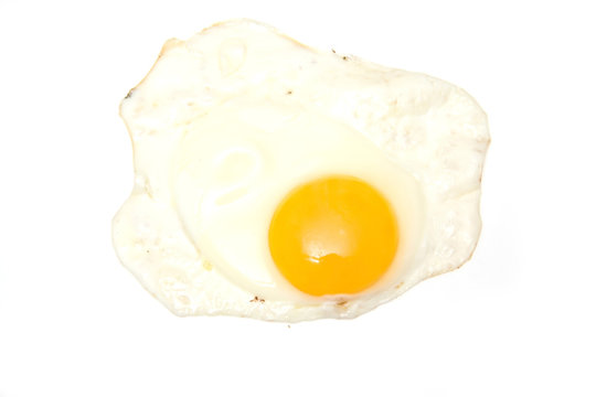 Fried egg isolated on a white studio background.
