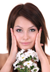 Beautiful young with flower. Facial massage.