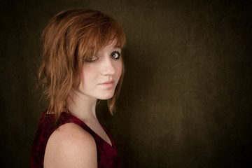 Naklejka premium Young girl on a green background
