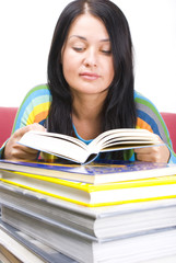 Young woman with stack of books