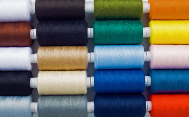 closeup of  multicolored sewing spools