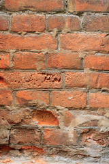 decayed red brick wall