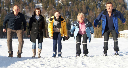 Happy jumping family