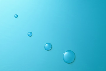 Drop of water on blue board