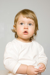 Fototapeta premium Studio portrait of small smiling girl
