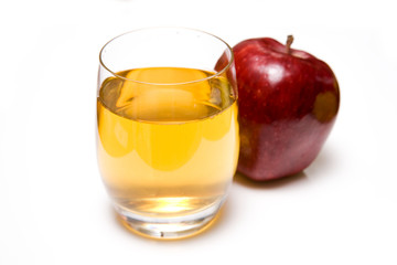 Glass of apple juice and red apple