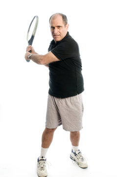 happy middle age man playing tennis back hand
