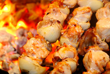 Meat is fried on fire