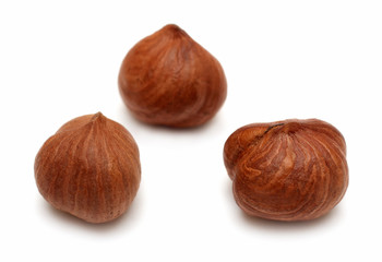 three clear hazelnuts