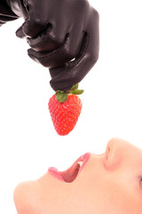 Obraz premium Beautiful girl holding strawberry