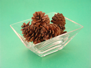 pine cones in glass dish