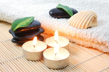 foldet white bath towel and zen stones