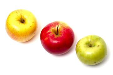 three multicolored apples in a row