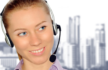 Woman wearing headset in office; could be receptionist