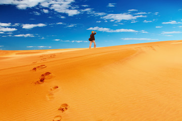Fototapeta na wymiar Sand dune climbing