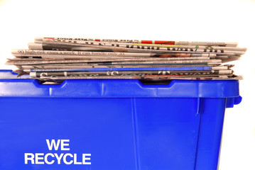 Recycling bin with newspapers