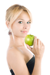 beautiful woman holding a green apple