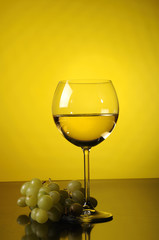 White wine and a grape