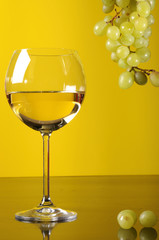 White wine and a grape