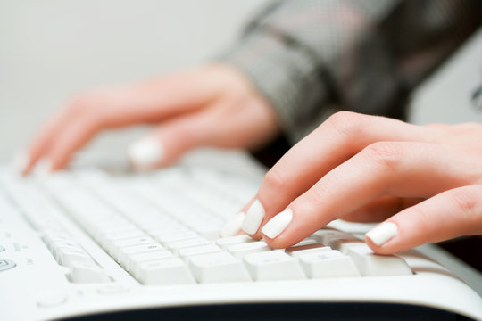 Female hands typing.