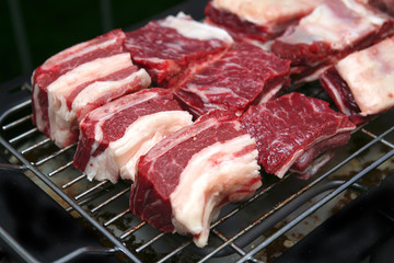 fresh ripe meat on bbq grill