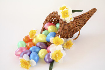 Easter cornucopia with eggs and daffodils.