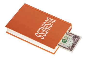 One dollar banknote inside book with title Business