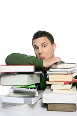 Young unhappy student with stacked books