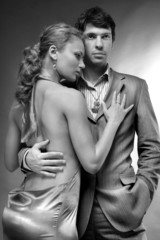 Portrait of a young beautiful couple. Young woman embraces man.