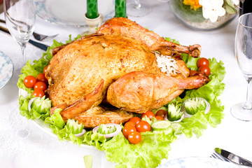 Feasting backed turkey on holiday table ready to eat