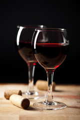 red wine in glasses and corks