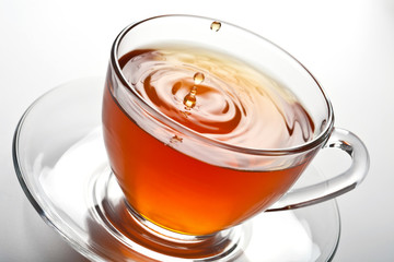 tea splash in glass cup