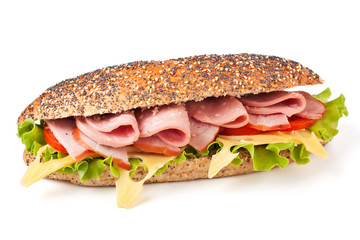 long whole wheat baguette sandwich with lettuce, tomatoes, ham,