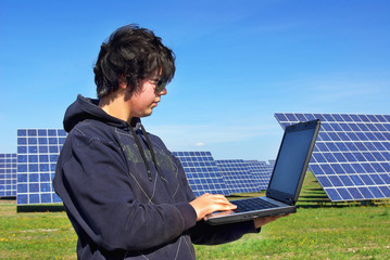 Young man in Central of photovoltaic panels.