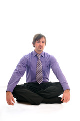 young business man meditating