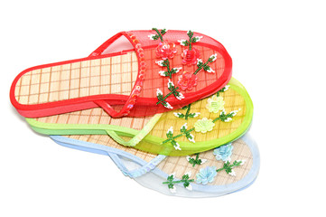 Multi-coloured slippers on a white background
