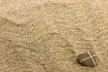 Fototapeta na wymiar sand and sea stone