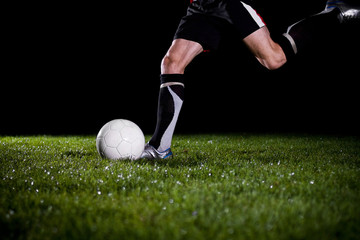 soccer player is going to kick the ball - obrazy, fototapety, plakaty