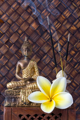 Buddha With Incense Sticks And Flower