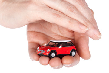 Red car in hands