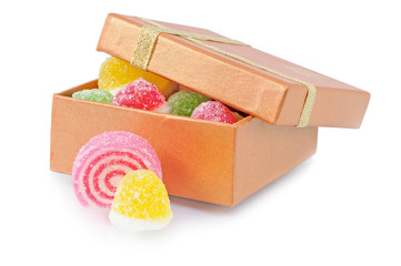 two sweet candy lie near box with candy