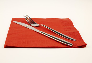 fork and knife on a red napkin - Powered by Adobe