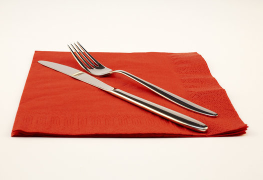 Fork And Knife On A Red Napkin