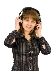 Fototapeta premium Beautiful girl listening to the music. Isolated on white.