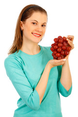 Beautiful girl with a brunch of grapes. Isolated on white