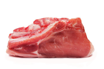 Piece of crude meat of pork on a white background